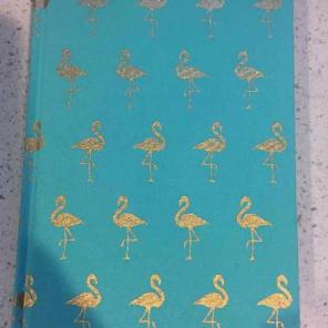 Green journal with gold flamingos