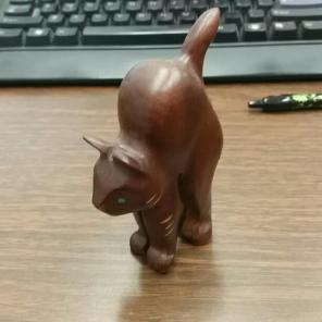 Wooden cat sculpture