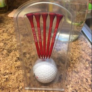 Coca Cola Golf ball and Tee.
