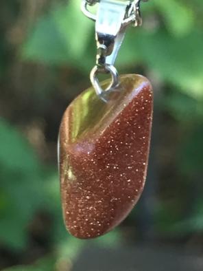 Goldstone pendant with spell for success
