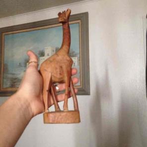 Hand carved giraffe from estate