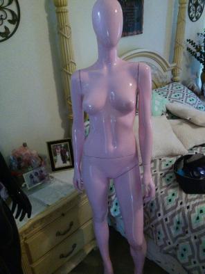 2 pink mannequins with stands