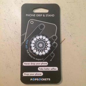 Black, blue, and white pop socket