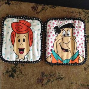 Wilma and Fred Flintstone pot holders
