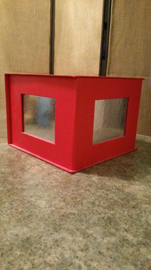 Bright red gift box w shiny silver sides