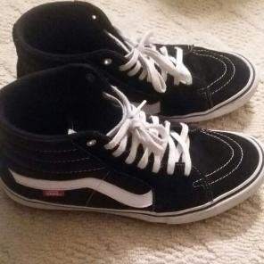Black and white Sk8-Hi Vans size 11.5