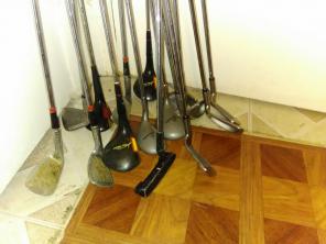 Assortment of golf clubs and bag