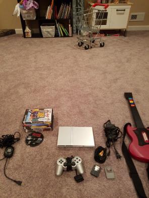 PlayStation 2 Slim Silver w/8 Games