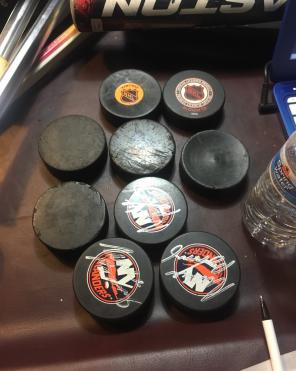 9 Hockey Pucks