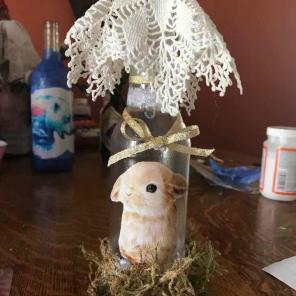 Glass lighted bottle with rabbit and mos
