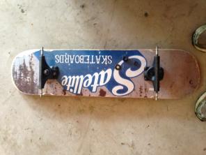 Skateboard Deck With Broken Trucks