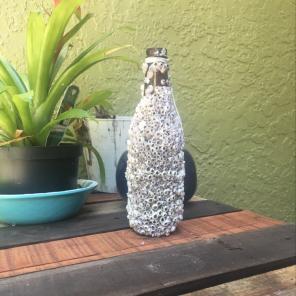 Beer Bottle With Barnacles On It