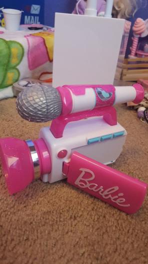 Kids play Barbie video camera