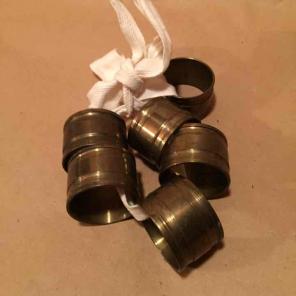 SIX BRASS NAPKIN RINGS