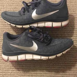 Gray and white nike running shoes/size 7