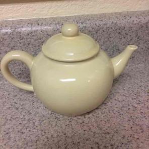 Small light yellow teapot