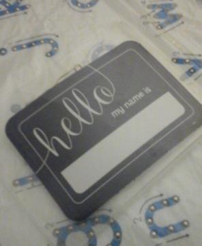 25 name tags in plastic enclosure w/pin