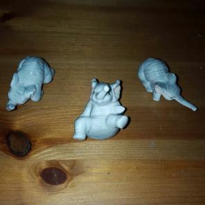 Three miniature ceramic elephants