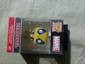 yellow and grey deadpool funko pop