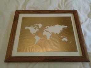 Framed golden artwork of the Earth