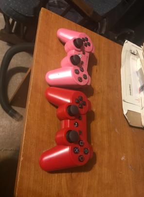 2 PlayStation 3 Controllers.