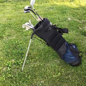 Golf bags with clubs