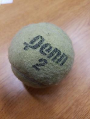 Old beat up tennis ball