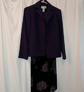 A plum jacket and a black sleeveless dre