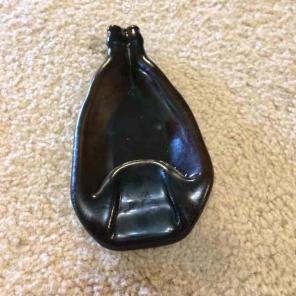 Melted brown bottle soap/spoon rest