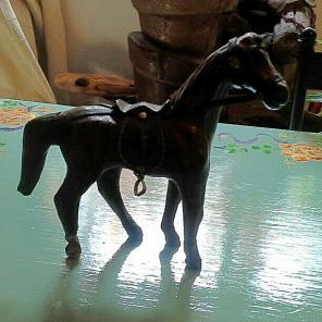 Carved wood horse covered with leather