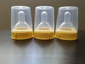 3 medela cap, nipple, and cover for baby