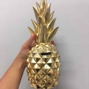 Gold pineapple coin bank