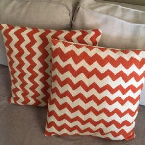 Set Of Orange Chevron Pillows