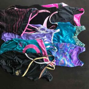 Lot of 8 Adult XS gymnastics leotards.