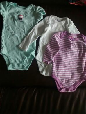 Onesies ranging from 6 months to 24 mont