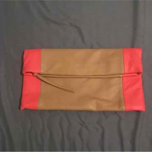 Tan and coral clutch