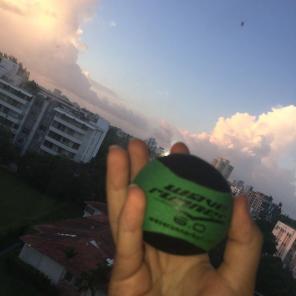 green and black squishy stress ball