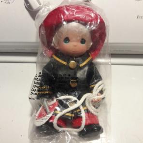 Precious moments fireman doll