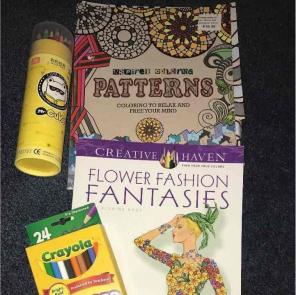 Adult coloring books and colored pencils