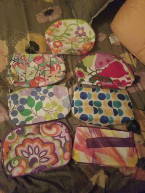 Seven unused Clinique Bags