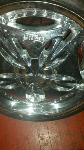 4 rims with tires with 4 cats
