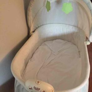 Cream and green bassinet