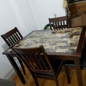 Brown Wooden table and 4 chairs.