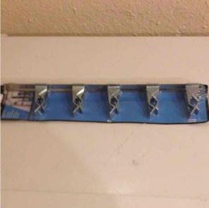 Sliding spring grip organizer