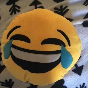 Laughing face emoji pillow