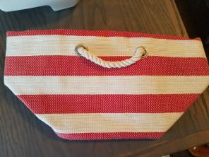 Red and white straw bag