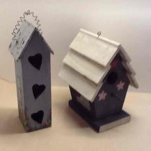 2 small wooden bird houses